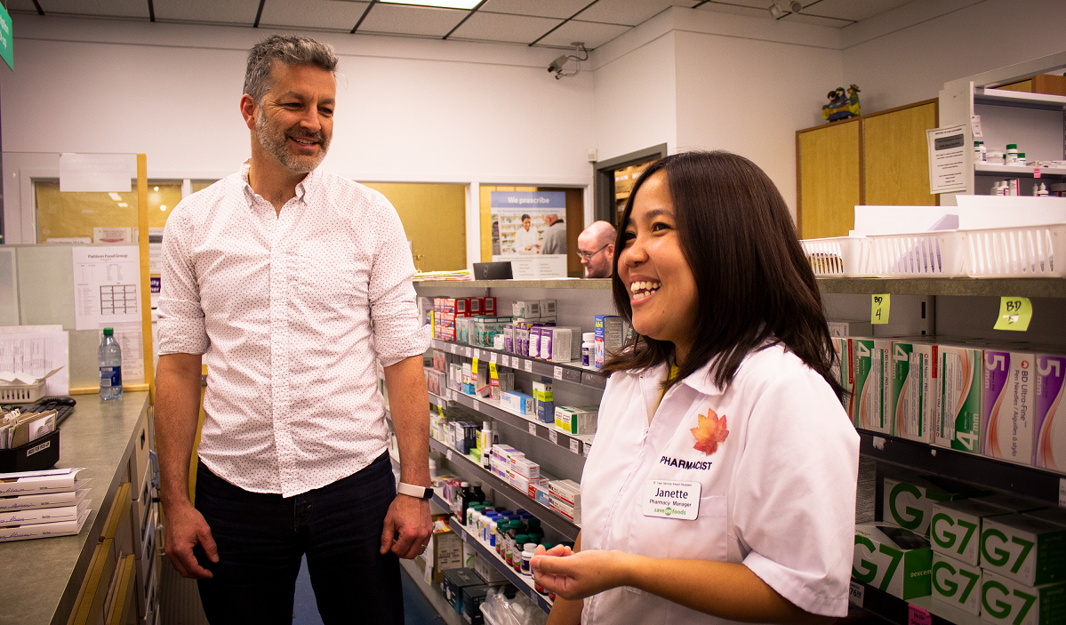 Janette Bowering, pharmacy manager at Save-on-Foods Pharmacy #2214, speaks with MLA Roly Russell about the types of supports pharmacies like hers could benefit from.